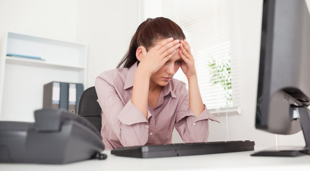 Frustrated businesswoman in office